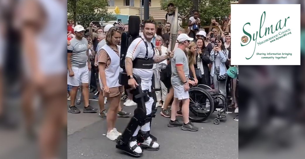 Olympic Torch carried through Paris while wearing a robotic exoskeleton