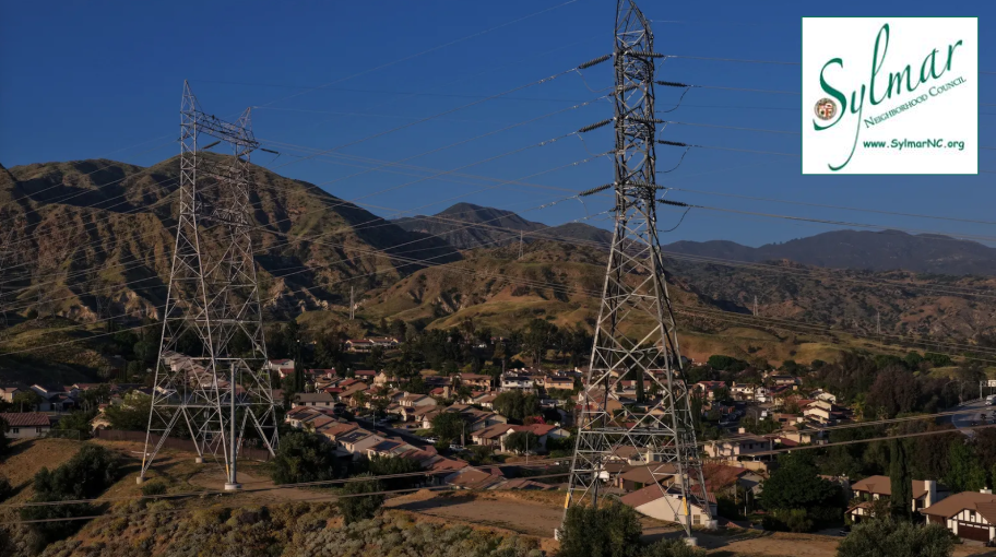 Electrical transmission lines hang over a housing development in Sylmar Calif.